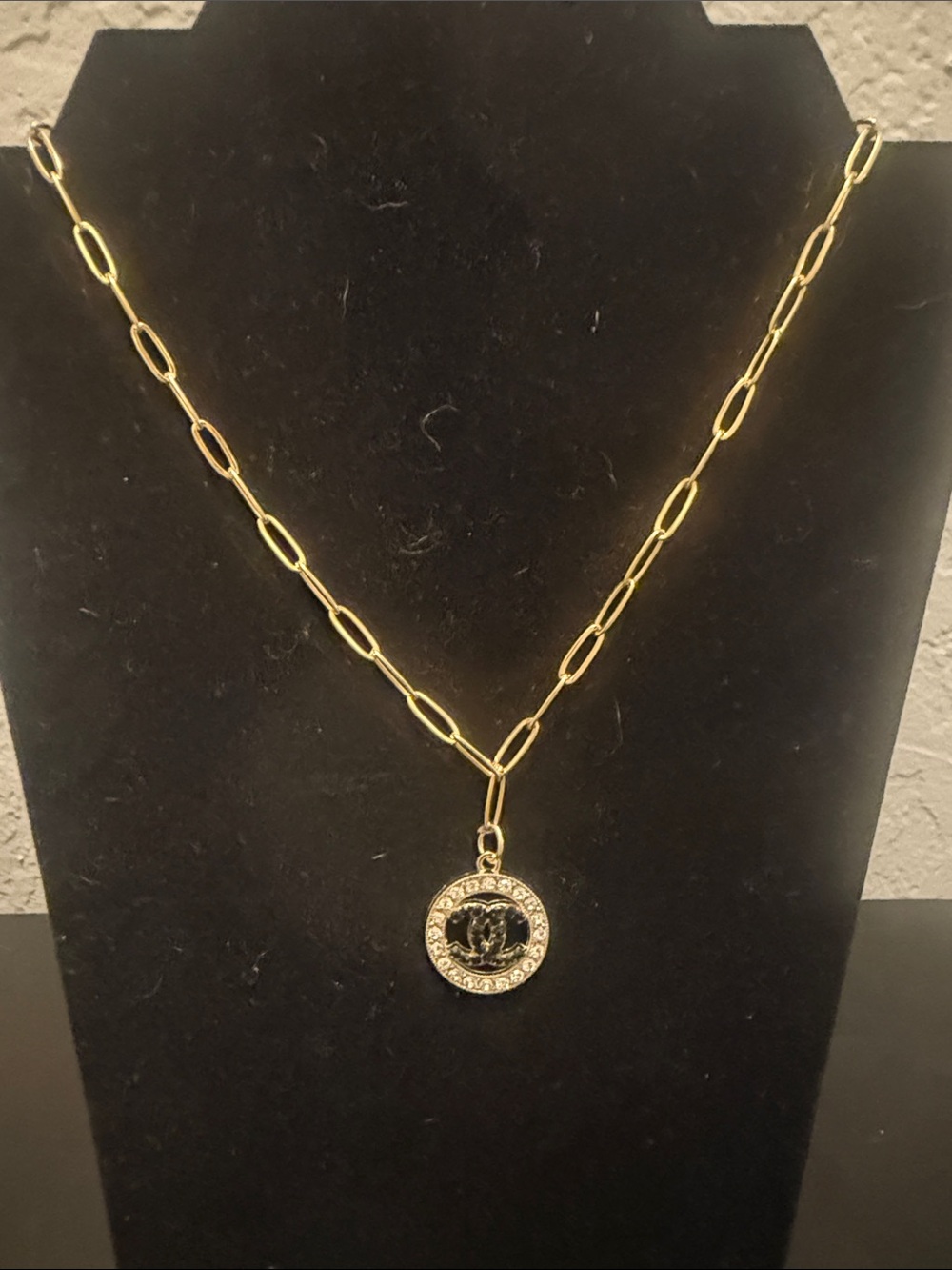 Inspired Gold-Tone Pendant Necklace with Black Enamel Center and Bling
